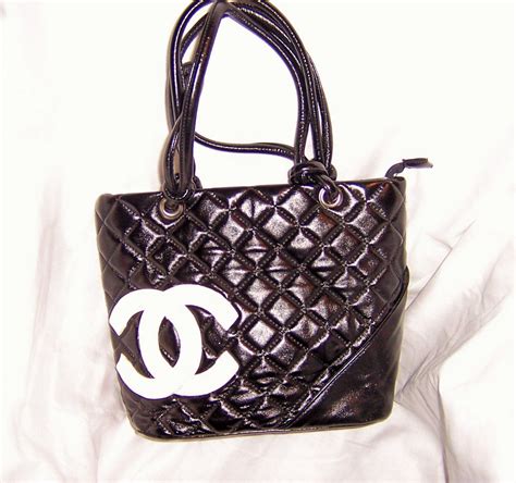 black chanel purse white logo